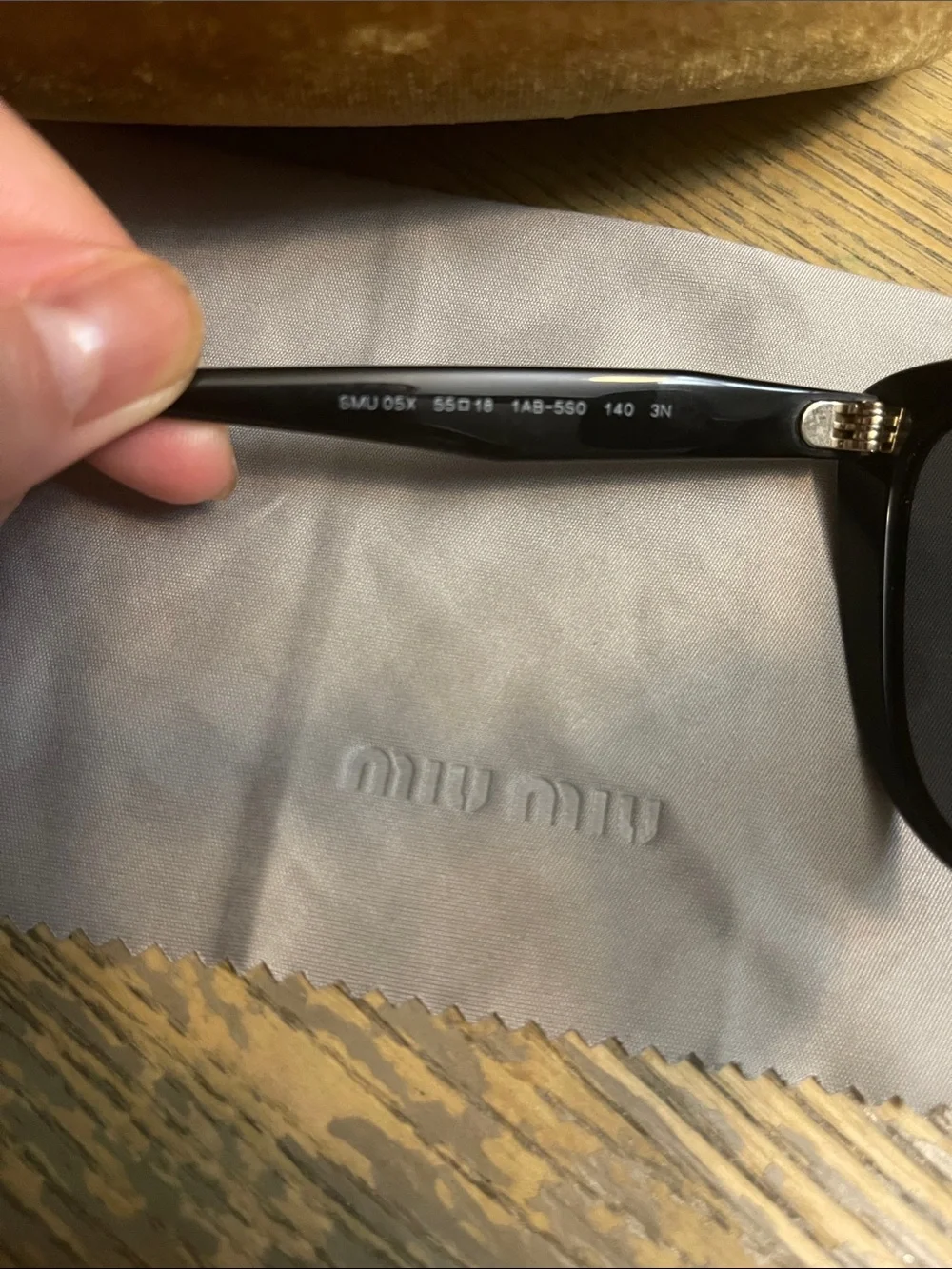 Miu Miu Black Cat-Eye Sunglasses with Dark Lenses